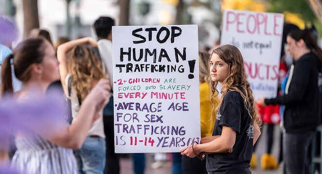 November 07, 2019 - Las Vegas, Nevada, USA: Young protestors show their support for stopping human trafficking in front of the Bellagio Hotel and Resort in Las Vegas, Nevada.